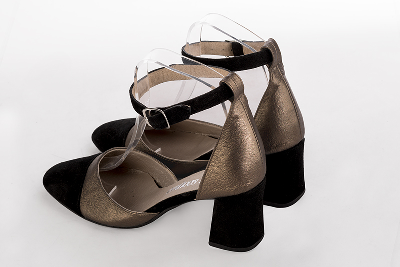 Matt black and bronze gold women's open side shoes, with a strap around the ankle. Round toe. Medium flare heels. Rear view - Florence KOOIJMAN